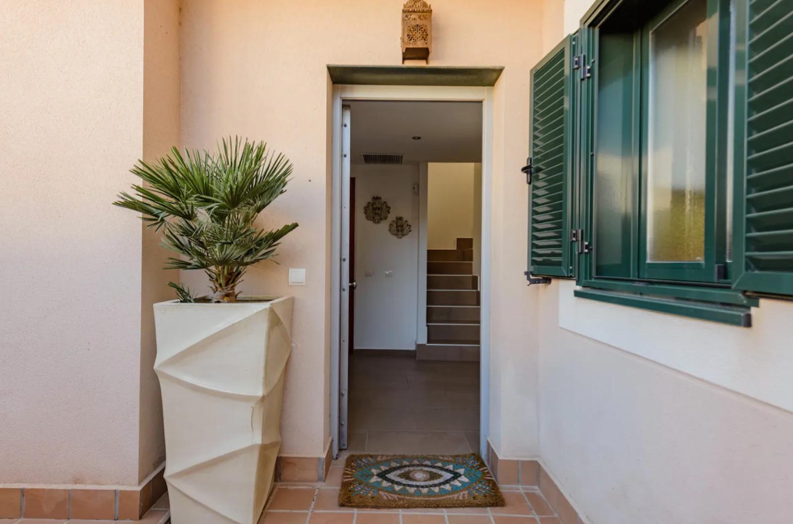 Resa Estates Ibiza te koop for sale townhouse cala tarida entrance.jpeg